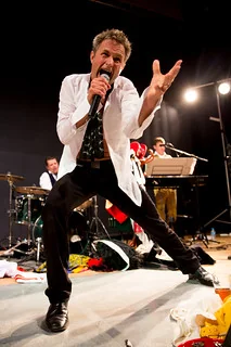 Miles in dramatic performance pose